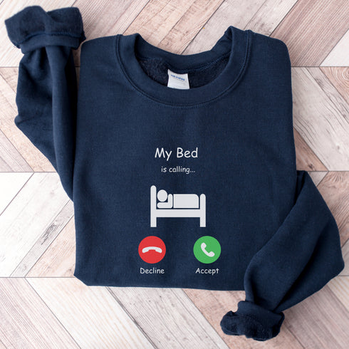 Introducing the ultimate sweatshirt for all those who love their bed more than anything else - the My Bed Is Calling Sweatshirt! Featuring a hilarious stick figure lying in bed, this sweatshirt is the perfect way to show off your love for all things cozy and comfortable.